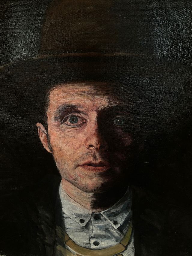 A portrait of Shawn whom stares straight into the viewers eyes.  The painting is painted in a most realisitic styele.